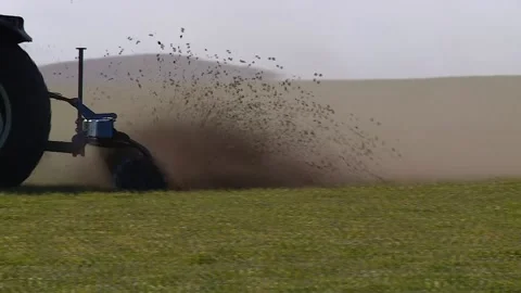 A tractor plows a green field in spring. closeup Stock Footage 130269243