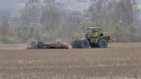 The tractor plows the ground. Stock Footage 153831061