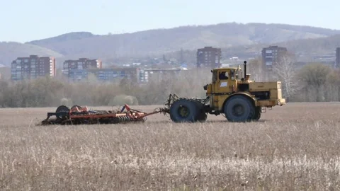 The tractor plows the ground. Stock Footage 153831088