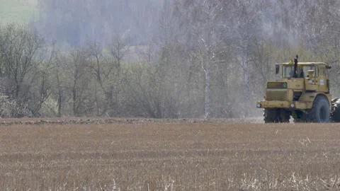 The tractor plows the ground. Stock Footage 153831109