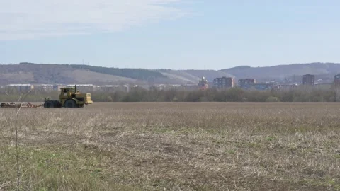 The tractor plows the ground. Stock Footage 153831115
