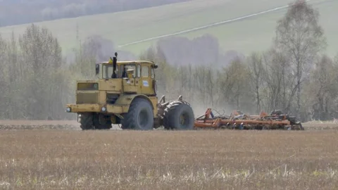 The tractor plows the ground. Stock Footage 153831148