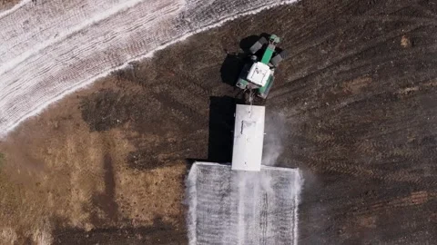 Tractor Pouring Lime Into The Soil To Neutralize The Soil Acidity. Stock Footage 276651823