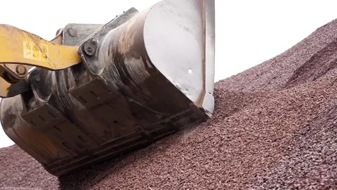 The tractor pours rubble from the bucket. Mountain of rubble. Stock Footage 196087724