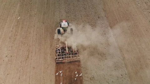 Tractor with a powerful unit, plowing, cultivating and rolling the soil before 스톡 동영상 116421027