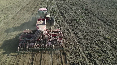 Tractor with a precision seeder sowing crops. Stock Footage 163951389