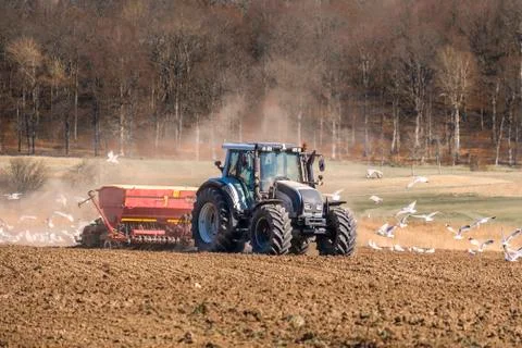 Tractor preparing the fields Stock Photos