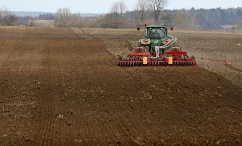 Tractor preparing land for sowing. Stock Photos