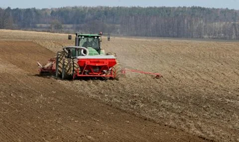 Tractor preparing land for sowing. Stock Photos