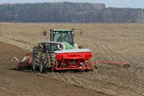 Tractor preparing land for sowing. Stock Photos