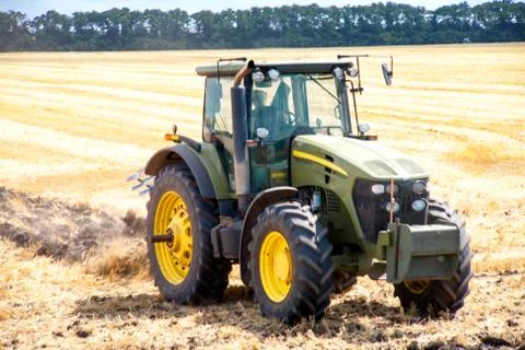 Tractor preparing land for sowing Foto stock