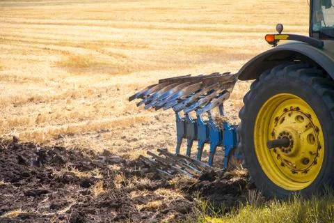 Tractor preparing land for sowing Foto stock