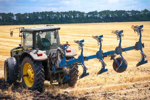 Tractor preparing land for sowing Stock Photos