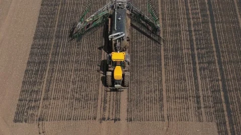 Tractor preparing slurry injection equipment for organic liquid manure Stock Footage 336717849