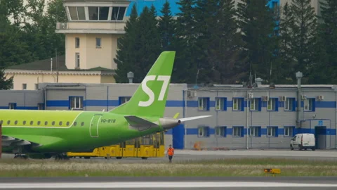 Tractor pulling aircraft S7 Airlines Stock Footage 286857216