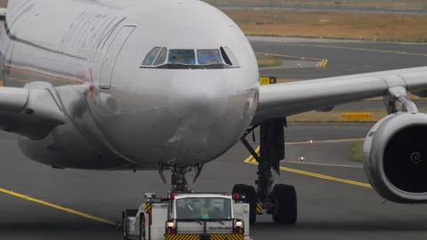 Tractor pulling an airplane Stock Footage 295234951