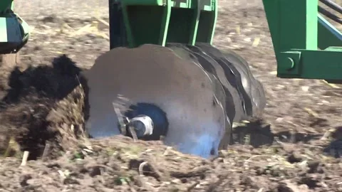 Tractor pulling a plow in mountainous terrain detail Stock Footage 324800633