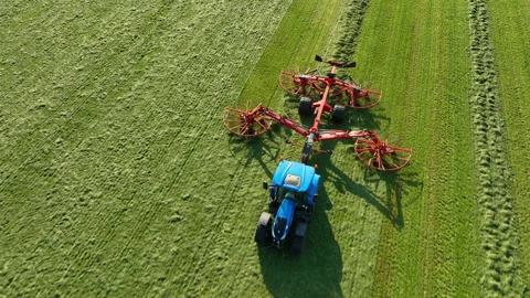 Tractor pulling a rotary rake Stock Footage 284330165