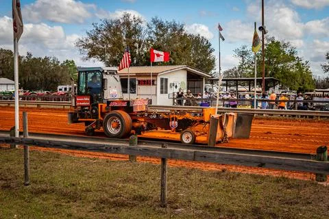 Tractor Pulling Sled Stock Photos