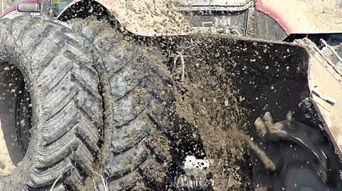 Tractor pulls a machine that cuts the channels in the field Stock Footage 48361910