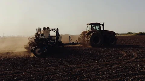 Tractor pulls the seed drill, agricultural machinery seeder. 스톡 동영상 93304156