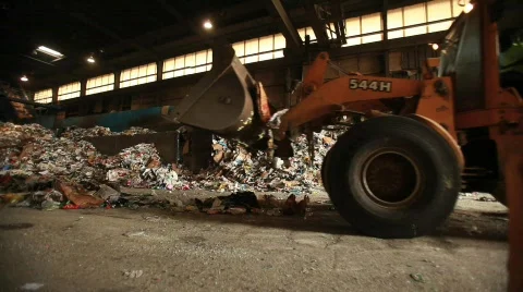 Tractor Pushes Trash in Factory 動画素材 594499