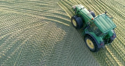 Tractor ramming silage, aerial view. Stockbeeldmateriaal 157494737