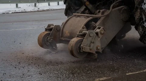 Tractor, removing asphalt cutter Stock Footage 56291328