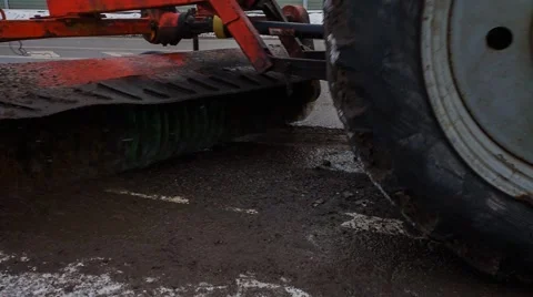 Tractor, removing asphalt cutter Stock Footage 56291357