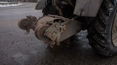 Tractor, removing asphalt cutter Stock Footage 56291443