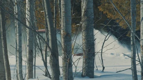 Tractor removing snow from the winter road in the forest Video stock 72506457