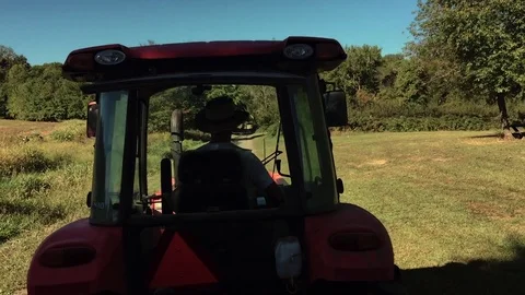 Tractor ride on a farm Stock Footage 77807943