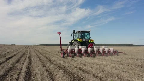 Tractor rides across the field close-up Stock-Footage 209931958