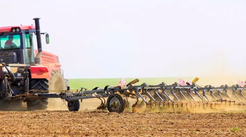 Tractor rides on the field Stock Footage 62783687