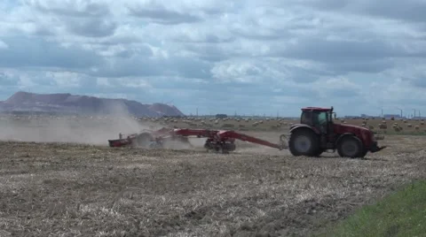 Tractor rides on the field.MTS Stock Footage 58596263