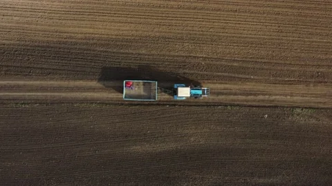 Tractor rides on the road with a trailer top view Stock Footage 201372596
