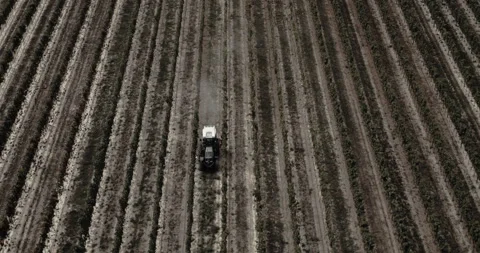 Tractor riding in between vines in vineyard aerial Stock Footage 254855799