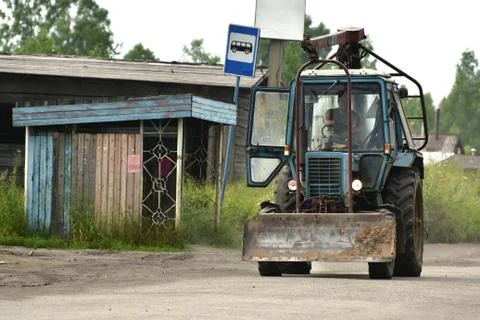 Tractor in the russian village Stock Photos