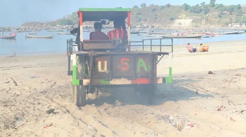 Tractor on sand beach 스톡 동영상 11440155