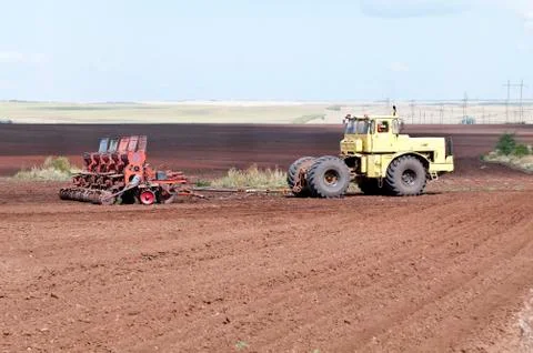 Tractor with seeder Stock Photos