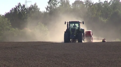 Tractor seeding grain crop on  field Stock Footage 36843405