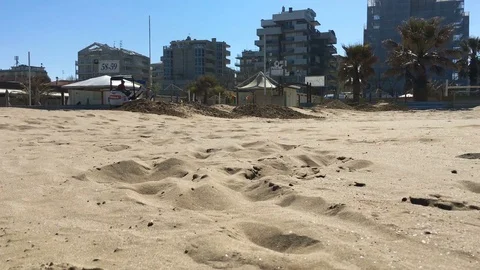 Tractor sifts the sand on the beach Stock Footage