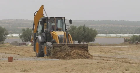 Tractor Smooths The Land Before Construction (4K) Stock Footage 61332394