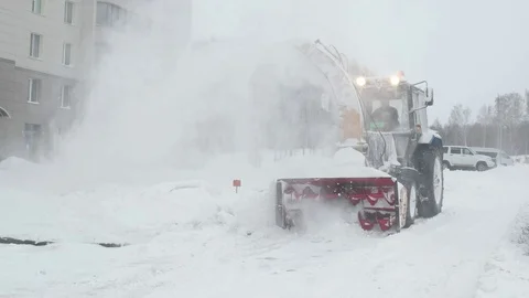 Tractor snow blower in a snowstorm. Close. Stock-Footage 70390427