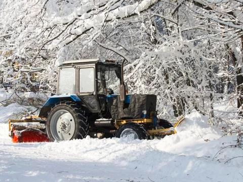 Tractor for snow cleaning Stock Photos