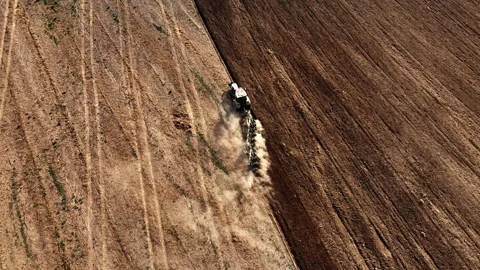 Tractor on Soil cultivation at field. Disk harrow on plowing field. Stock Footage 220102915