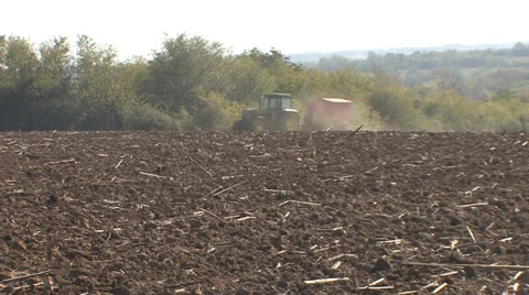Tractor sow corn and rising dust Stock Footage 36992382