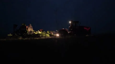 Tractor with sowing complex in field night Stock Footage 195095237