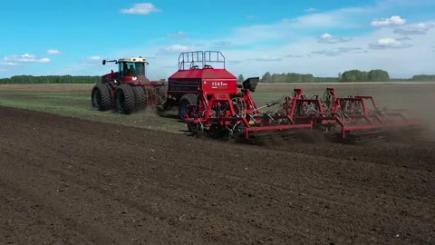 Tractor with sowing complex works in the field Stock Footage 130521567