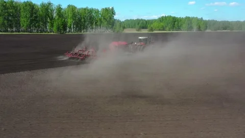 Tractor with sowing complex works in the field Stock Footage 130521892